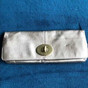 Coach gold clutch bag. New without tags